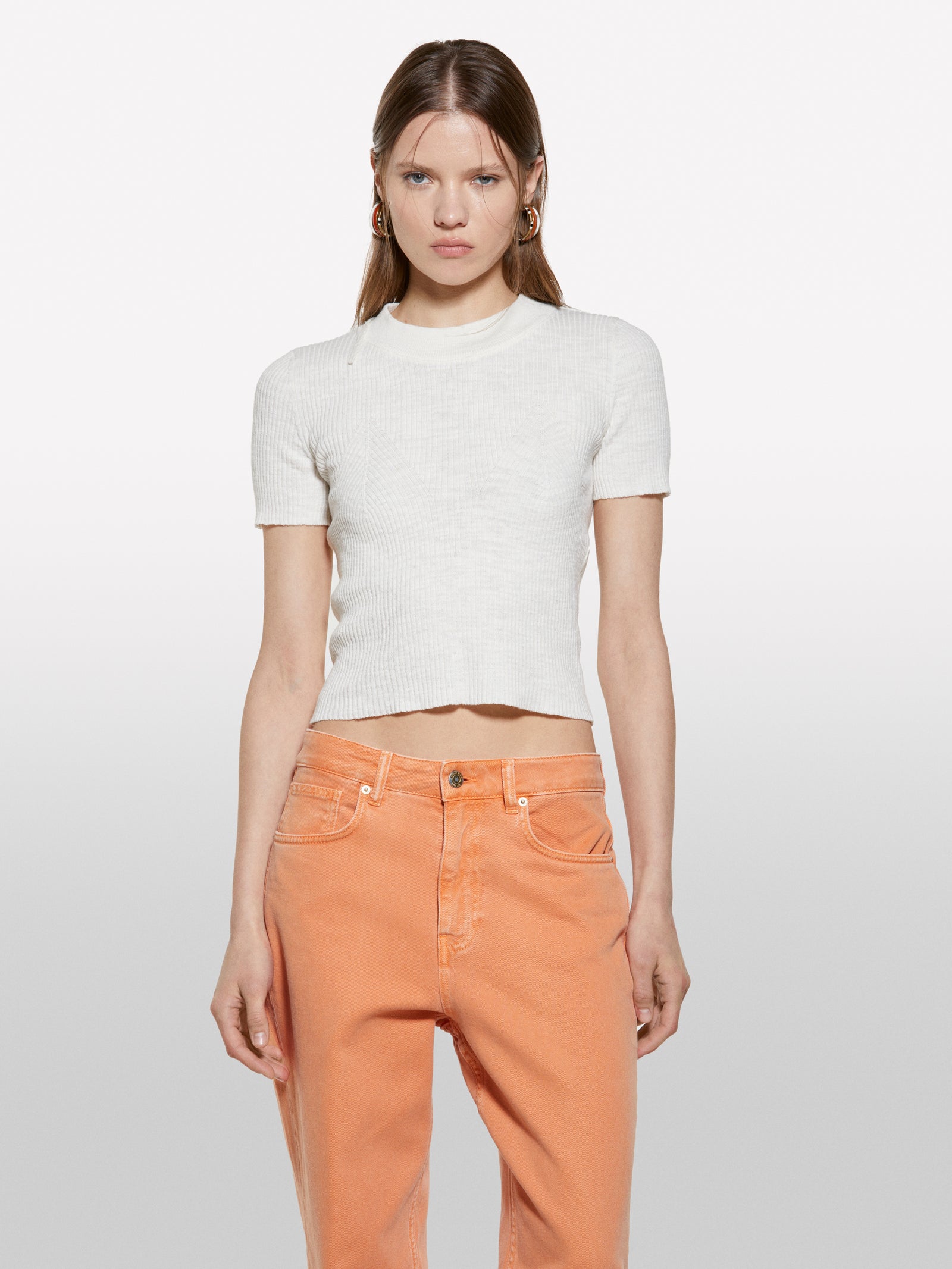 White top with porthole on the back